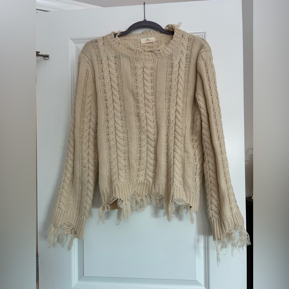 Cream sweater w/ fringe edges